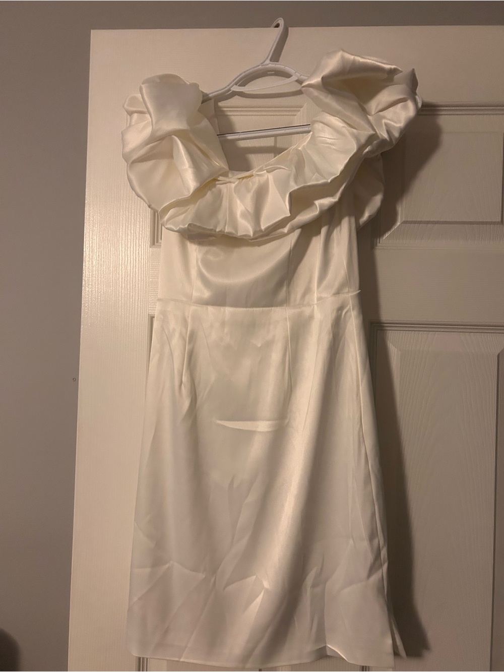 This white satin polyester off-shoulder ruffle A-line knee dress is perfect rush